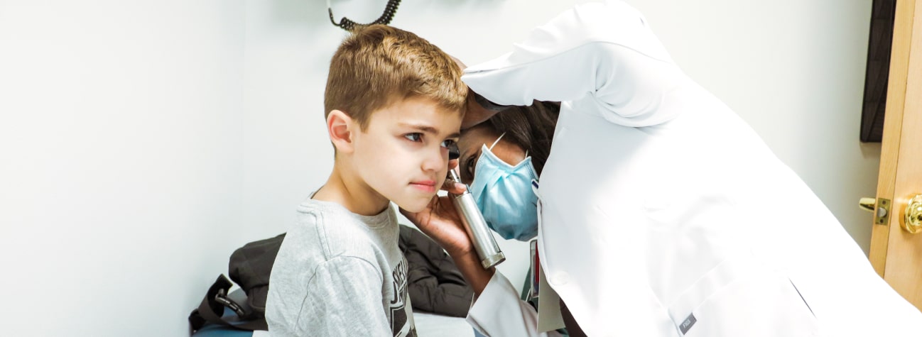 doctor checking a childs' ear