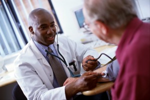 Doctor taking blood pressure