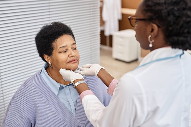 patient getting their chin checked