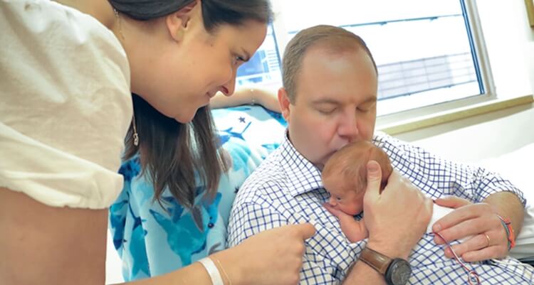 man holding his baby