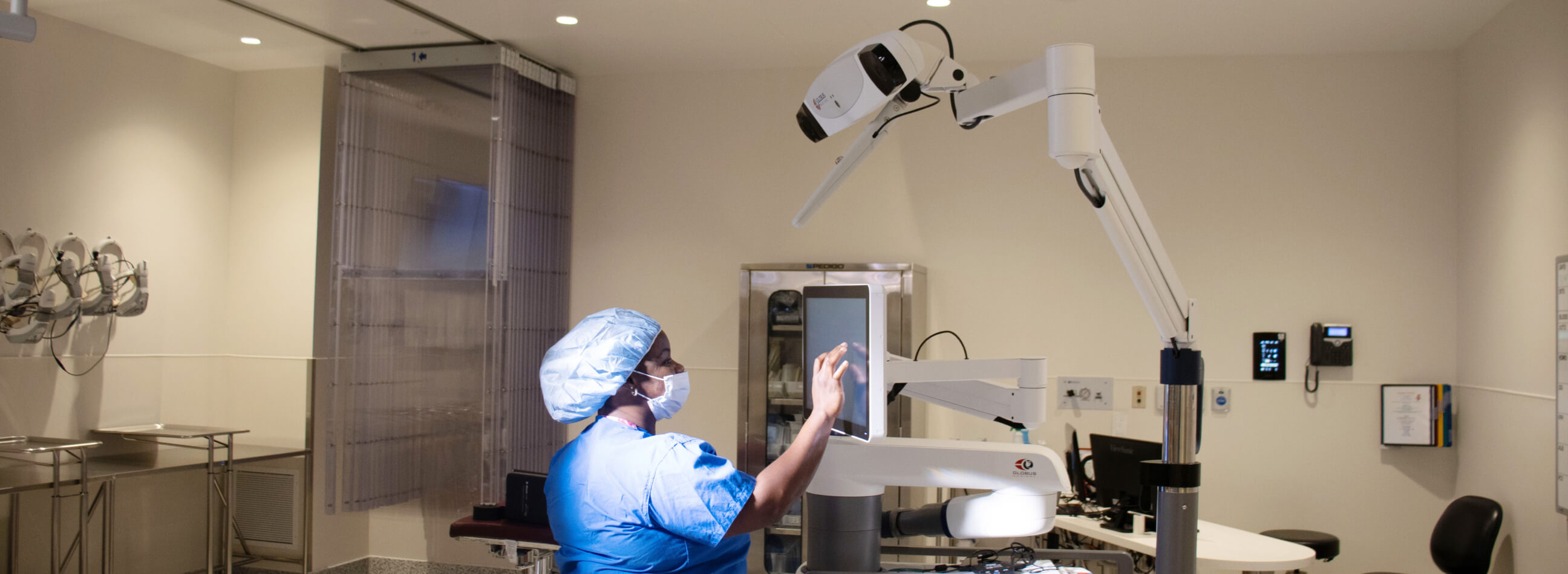 nurse operating the globus robot