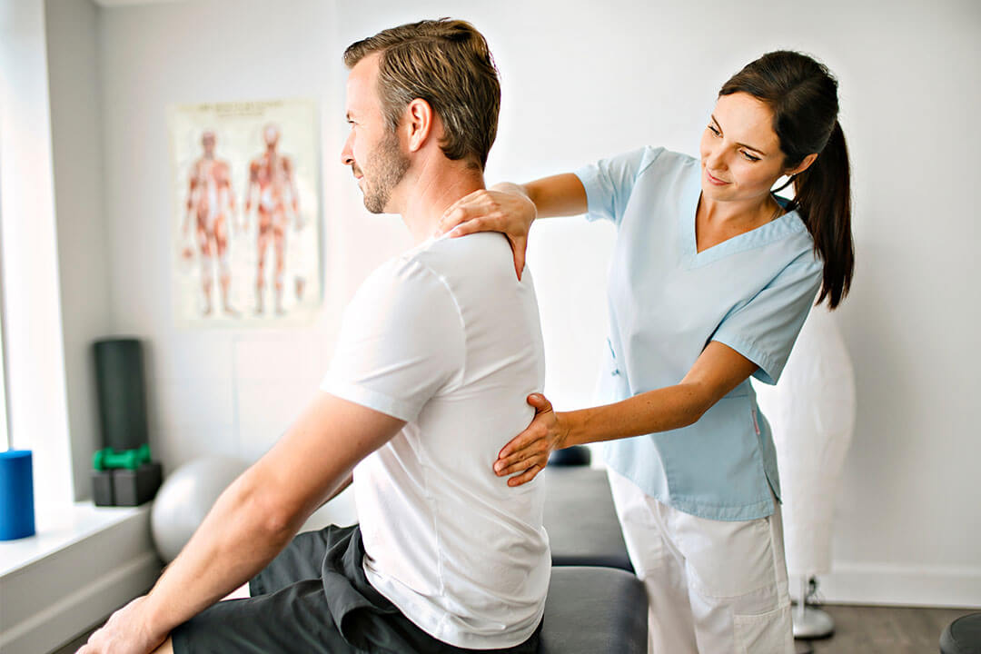 patient getting their back checked